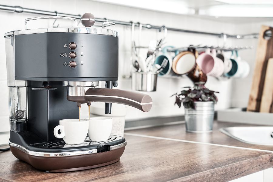 Coffeemaker with two cups in interior of modern kitchen closeup